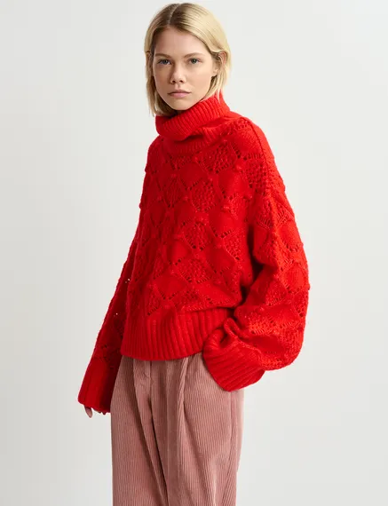 Red cable-knit turtleneck sweater