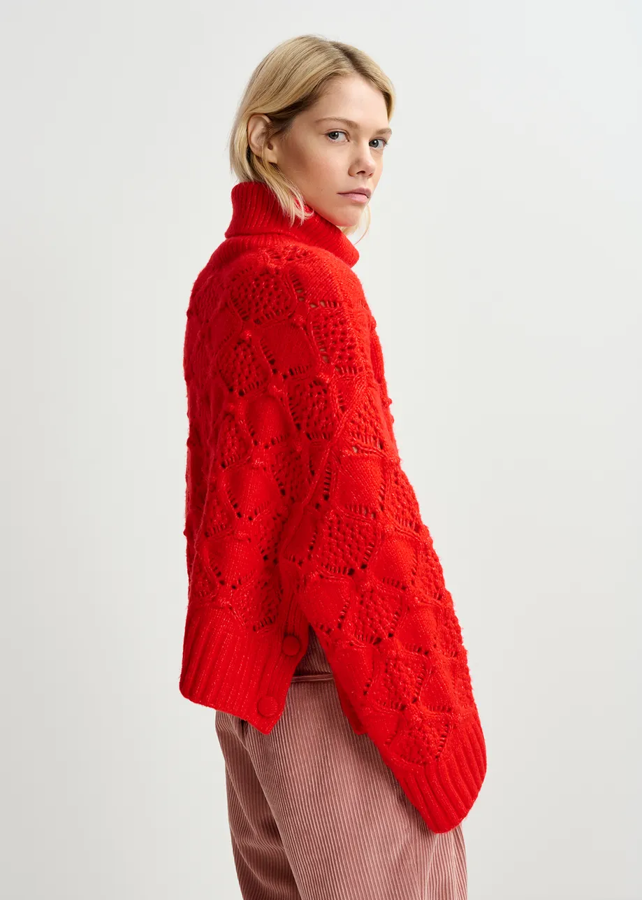 Red cable-knit turtleneck sweater