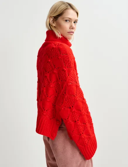 Red cable-knit turtleneck sweater