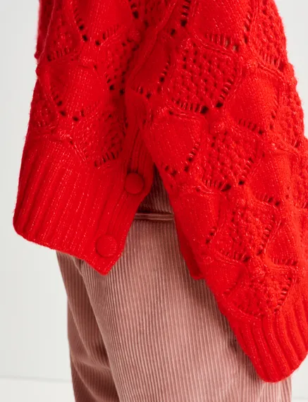 Red cable-knit turtleneck sweater