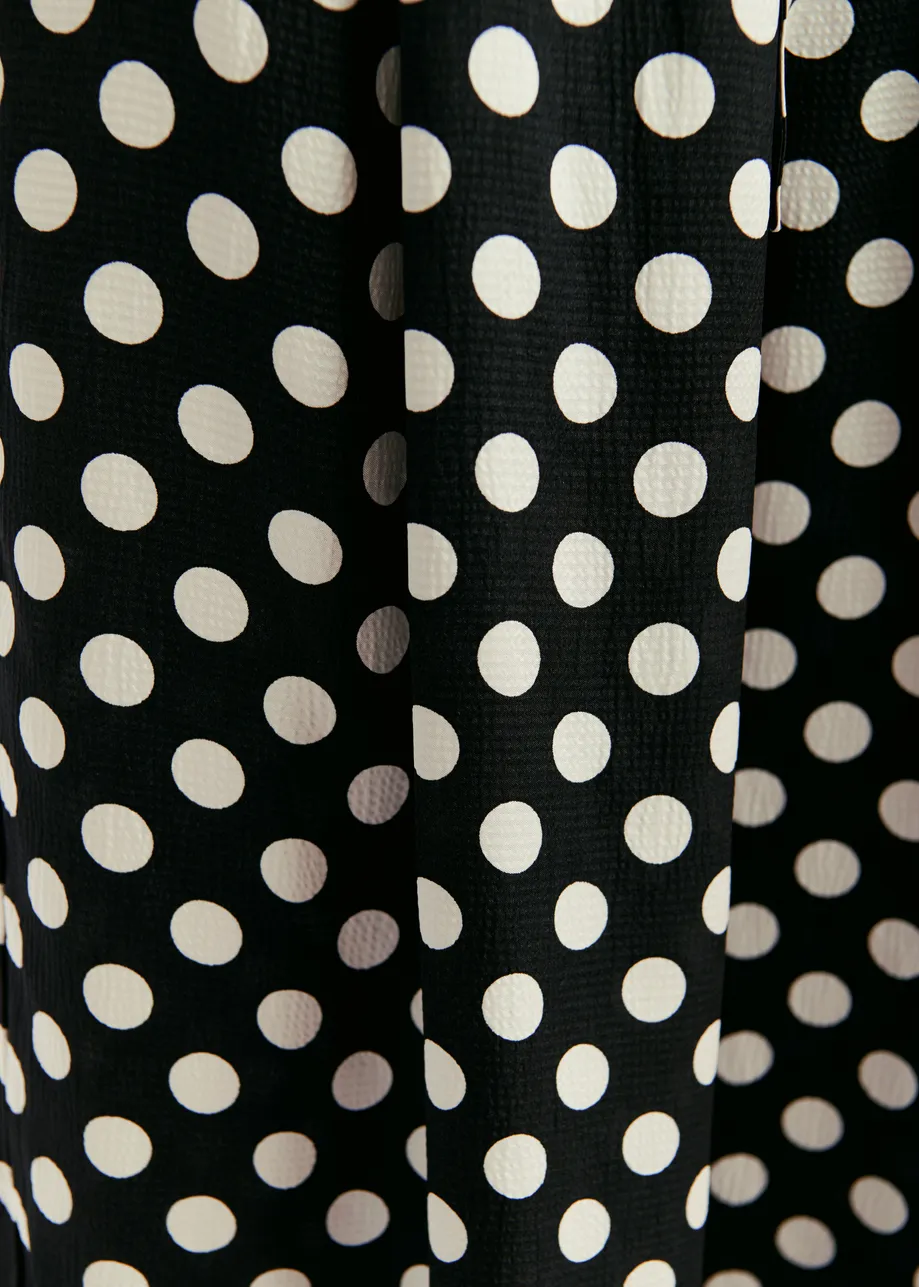 Black and white polka-dot wide-leg pants