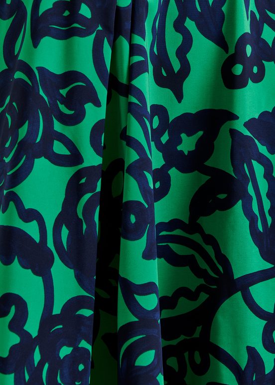 Groene en donkerblauwe midi-plissérok met bloemprint