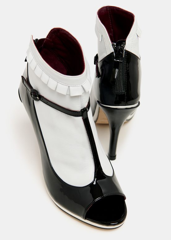 Black and white leather open-toe pumps