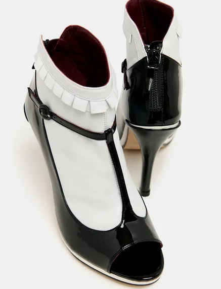 Black and white leather open-toe pumps