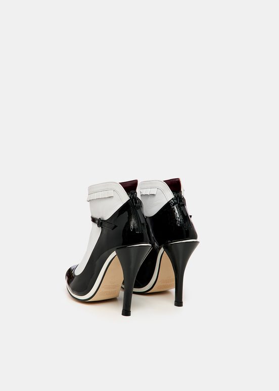 Black and white leather open-toe pumps