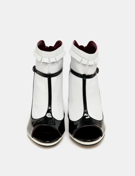 Black and white leather open-toe pumps