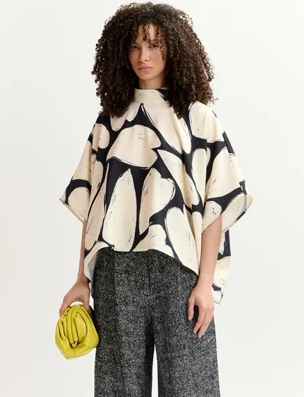 Black and off-white oversized top with stand-up collar