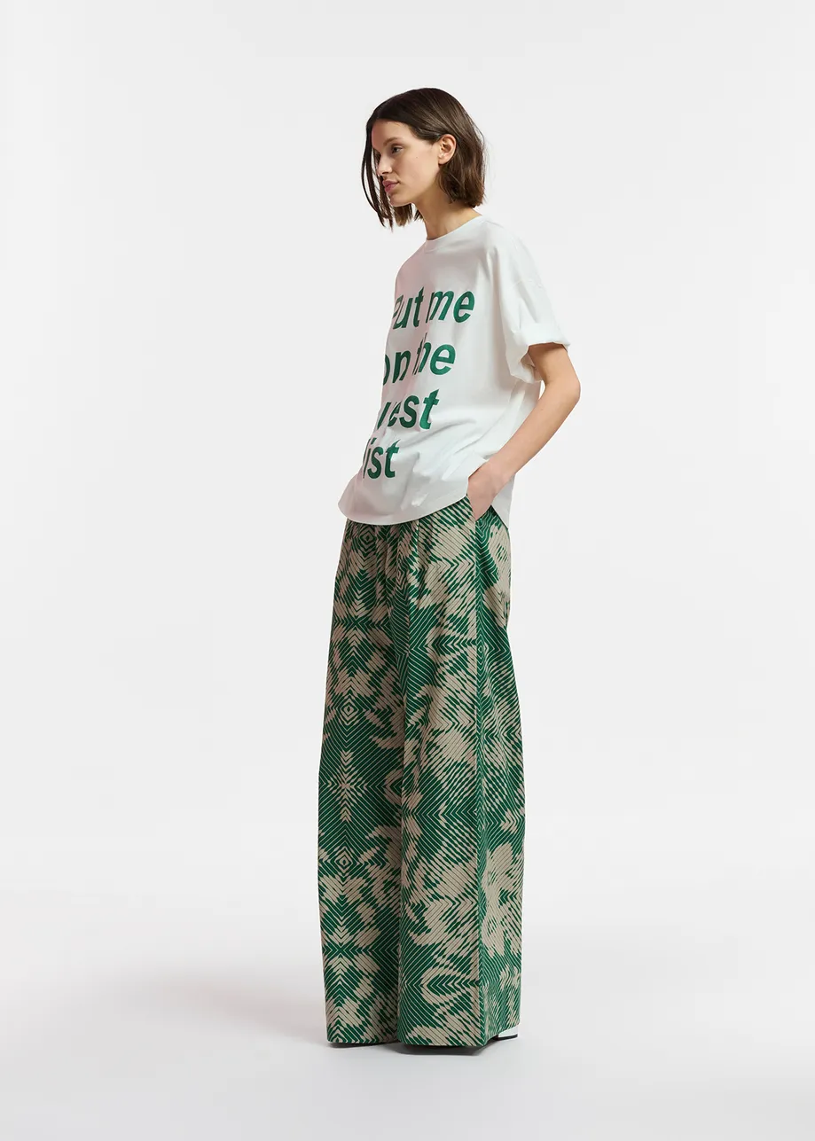 Beige and dark green wide-leg pants with geometric print