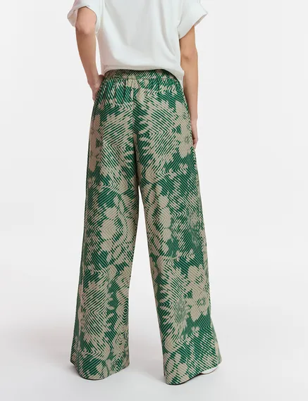 Pantaloni a gamba larga beige e verde scuro con stampa geometrica