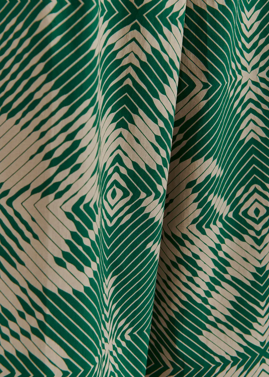 Beige and dark green wide-leg pants with geometric print