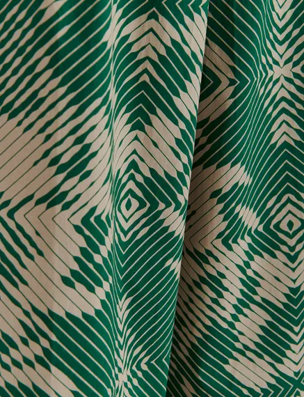 Beige and dark green wide-leg pants with geometric print