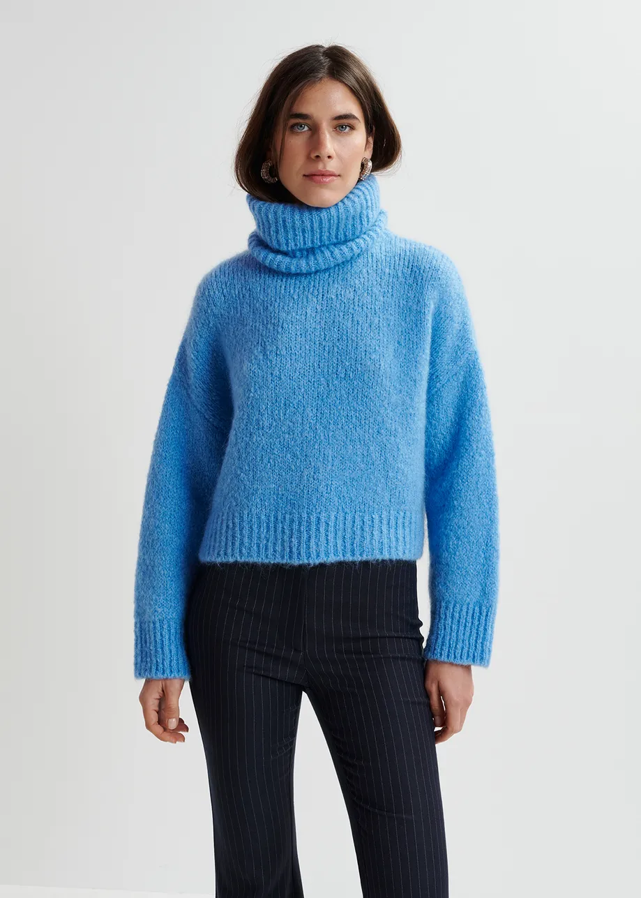 Blue turtleneck knit sweater