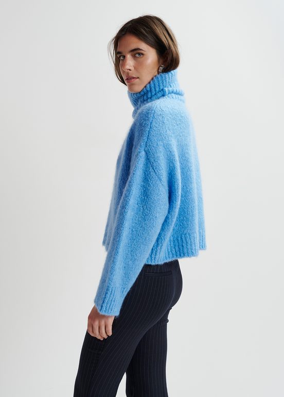 Blue turtleneck knit sweater