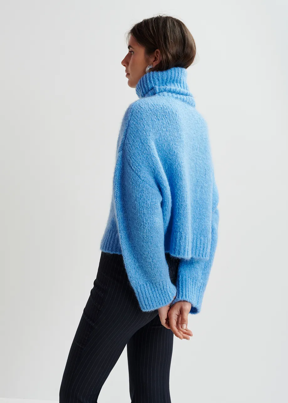 Blue turtleneck knit sweater