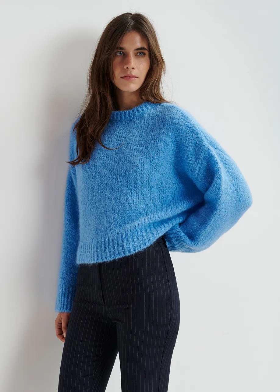 Blue turtleneck knit sweater