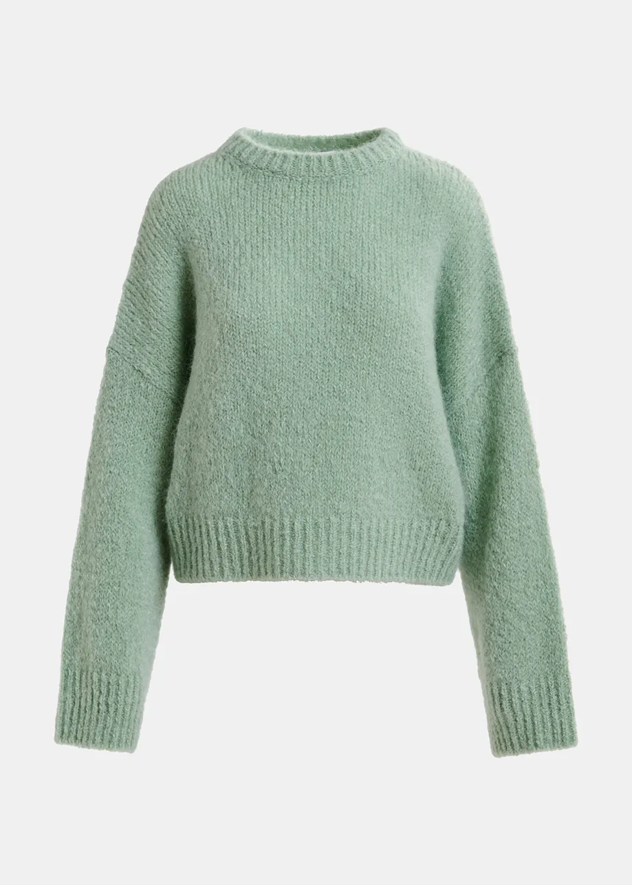 Maglione verde chiaro a collo alto 