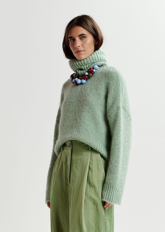 Light green turtleneck knit sweater