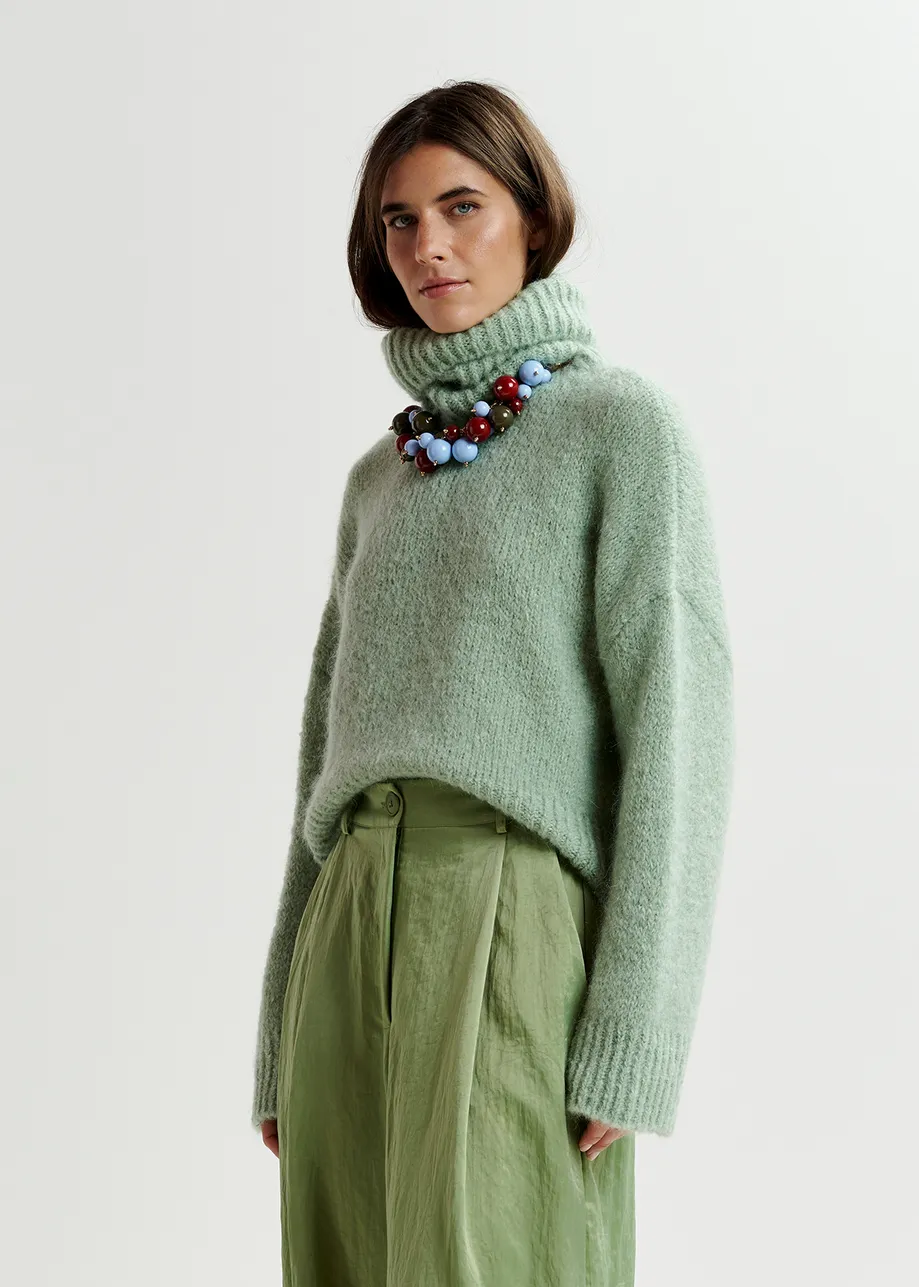 Light green turtleneck knit sweater