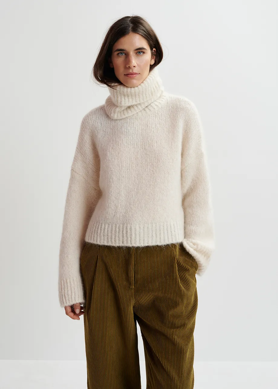 Ecru turtleneck knit sweater