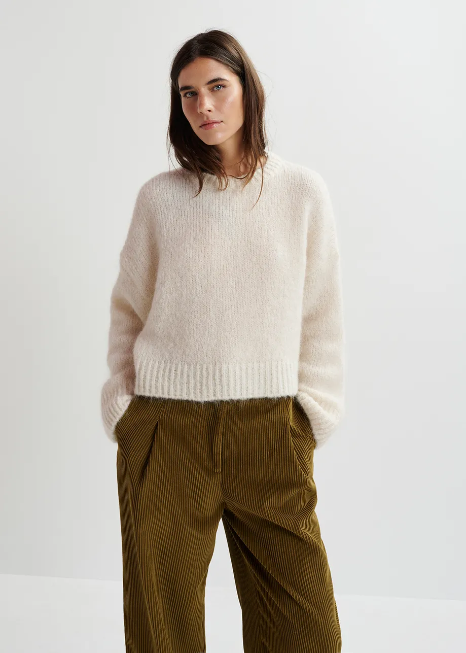 Ecru turtleneck knit sweater