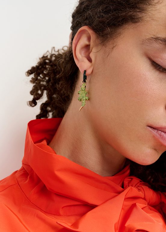 Black hoop earrings with crocodile and hot sauce pendants