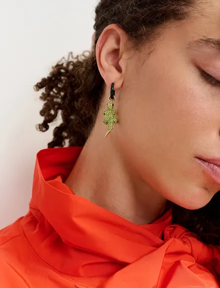 Black hoop earrings with crocodile and hot sauce pendants