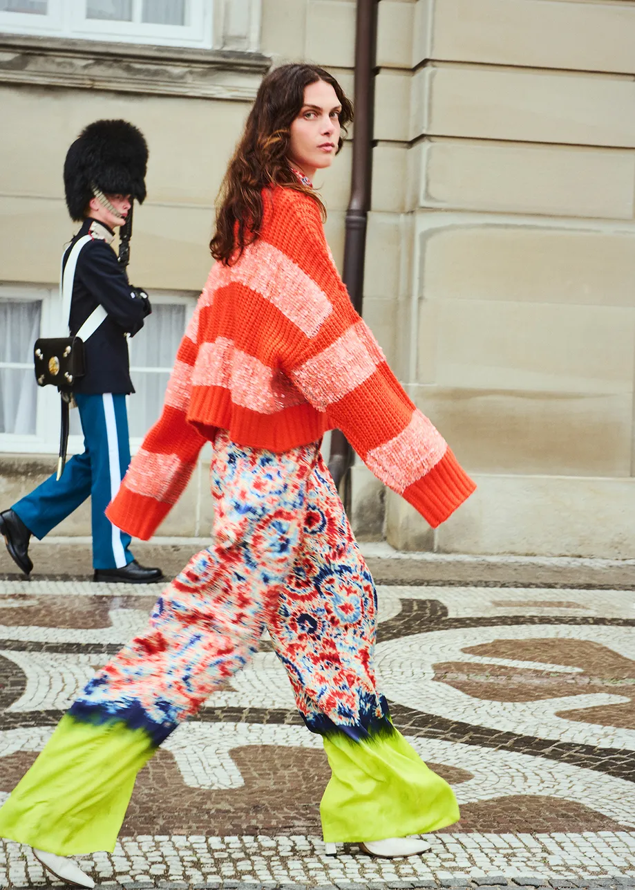 Orange knit sweater with sequin-embellished stripes