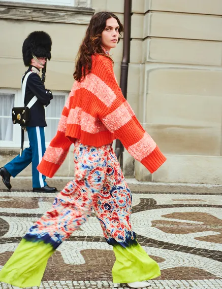 Orange knit sweater with sequin-embellished stripes