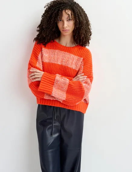 Orange knit sweater with sequin-embellished stripes