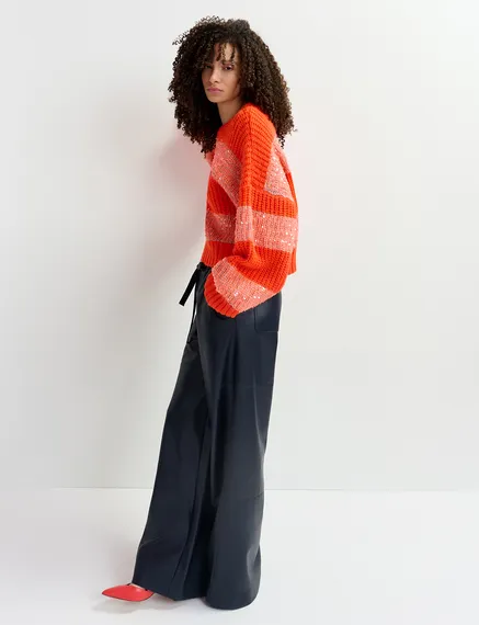 Orange knit sweater with sequin-embellished stripes