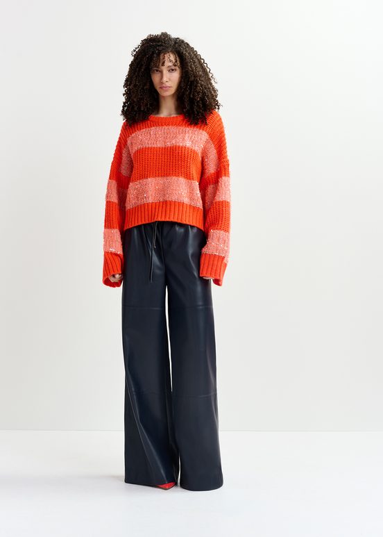 Orange knit sweater with sequin-embellished stripes