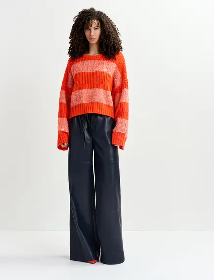 Orange knit sweater with sequin-embellished stripes