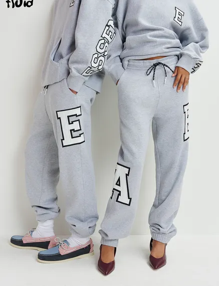 Grey cotton sweatpants with embroidered patches