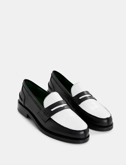 Black and white leather loafers