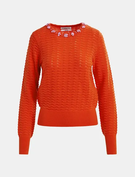 Maglione rosso con scollo decorato