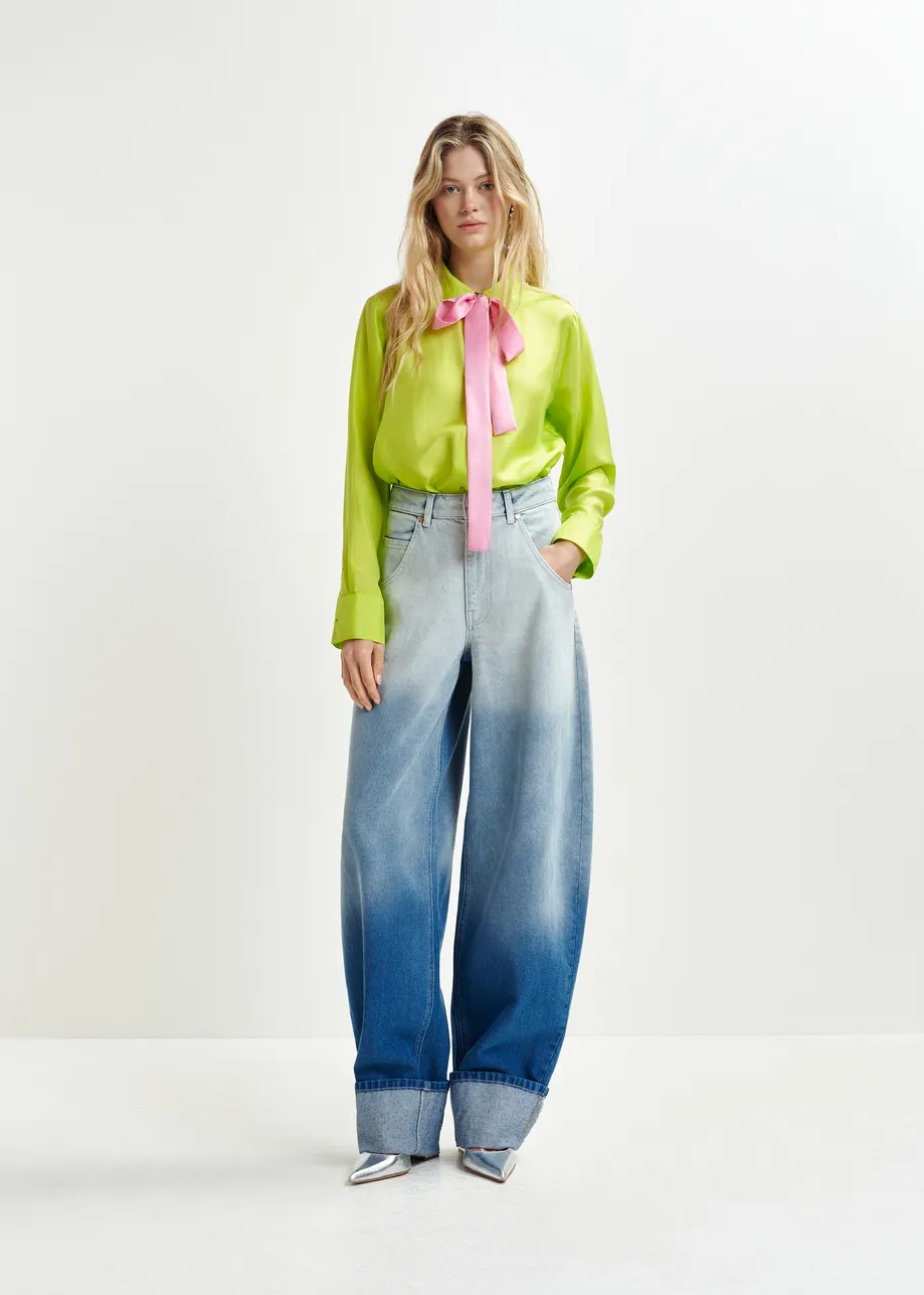 Blue balloon-fit jeans with folded cuffs and tie-dye effect