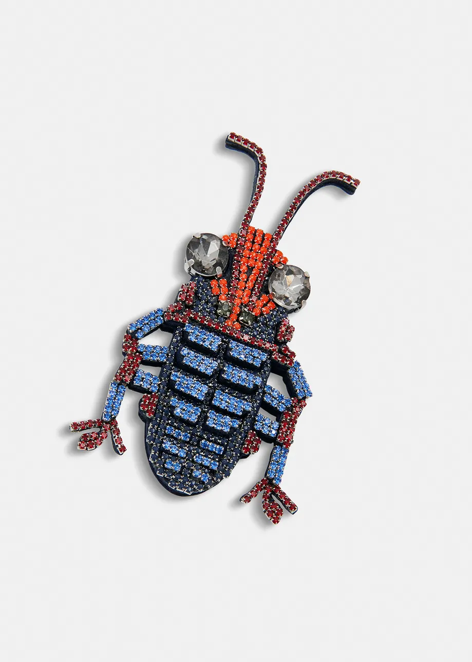 Navy, orange and green rhinestone bug brooch