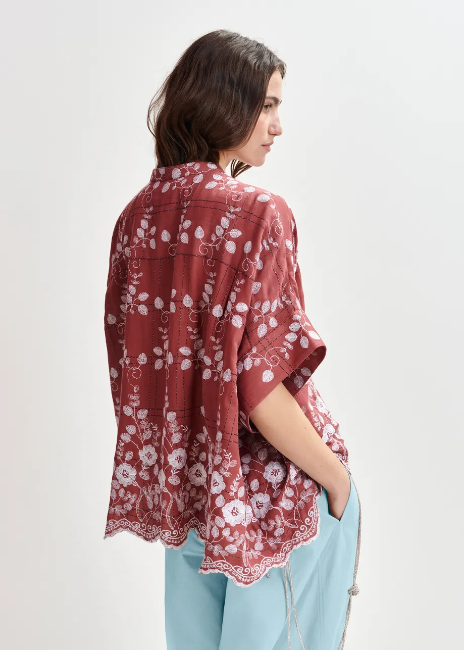 Brown and white check pattern shirt with floral embroidery and a scalloped hemline