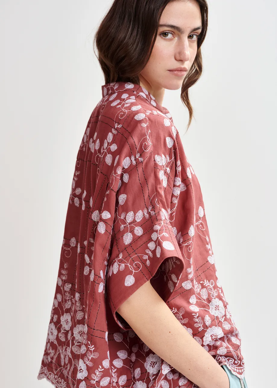 Brown and white check pattern shirt with floral embroidery and a scalloped hemline