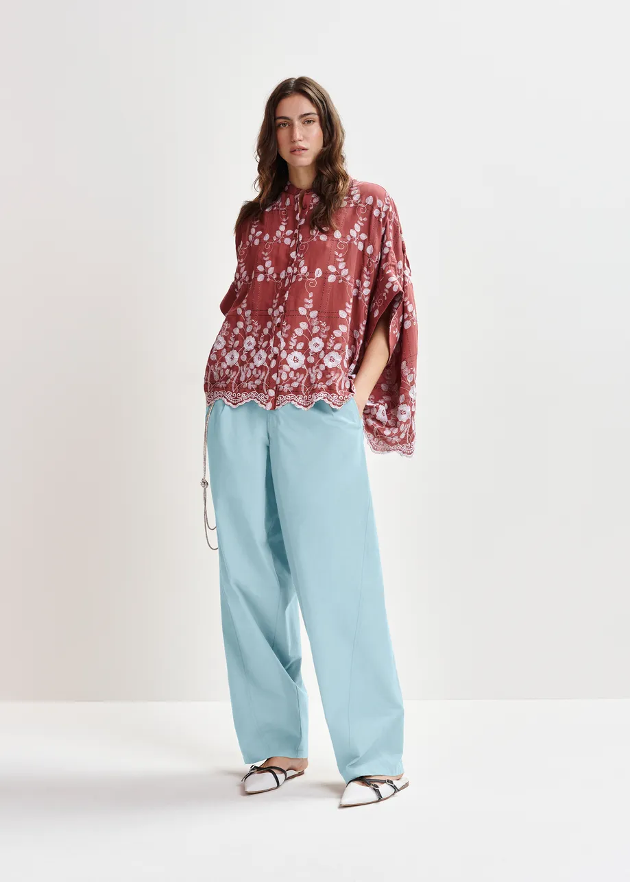 Brown and white check pattern shirt with floral embroidery and a scalloped hemline
