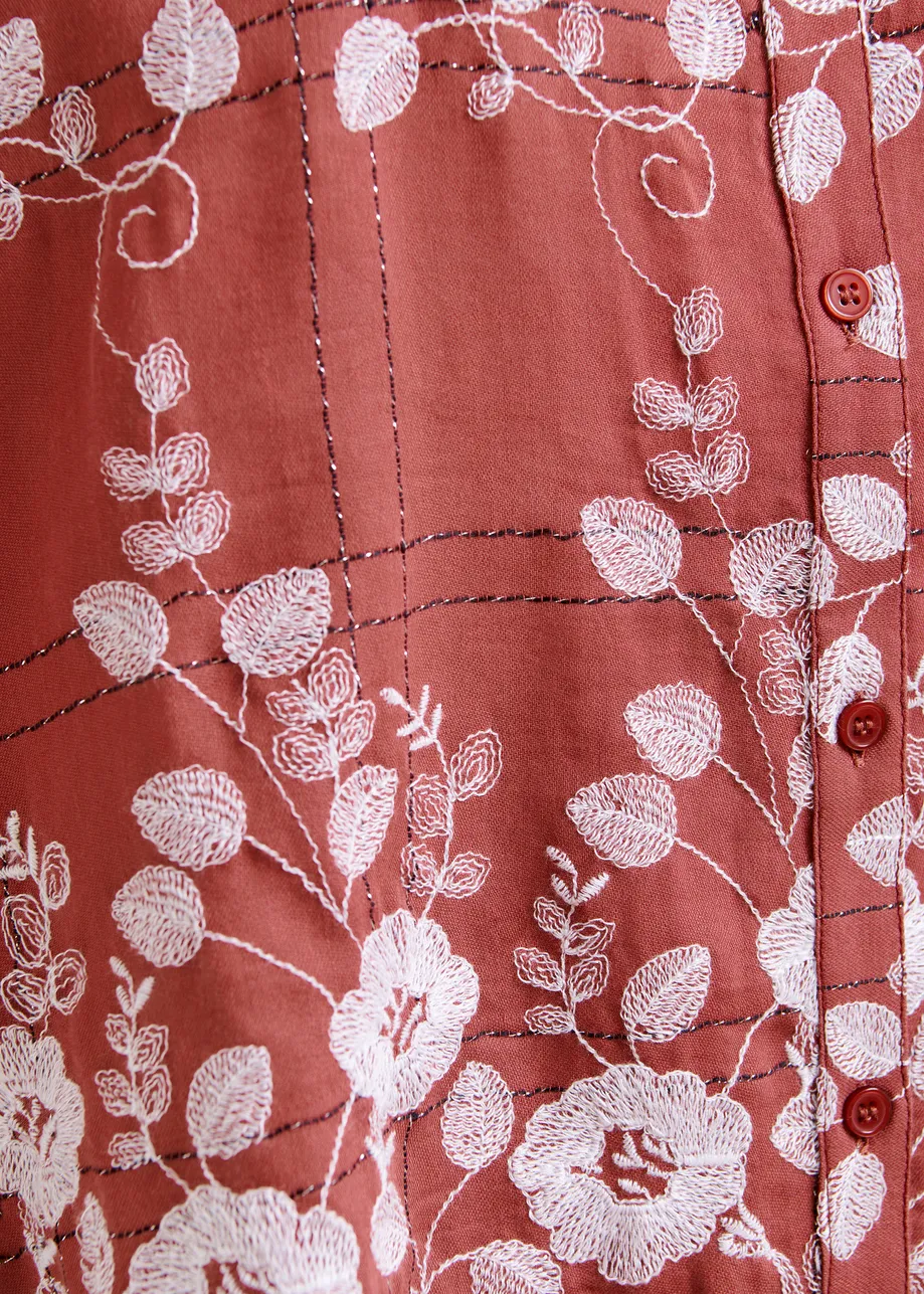 Brown and white check pattern shirt with floral embroidery and a scalloped hemline