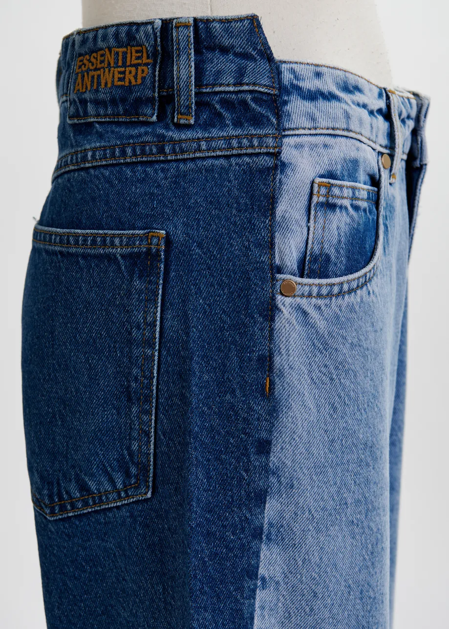 Light and dark blue contrasting panel jeans with uneven waistline and raw-cut hemline