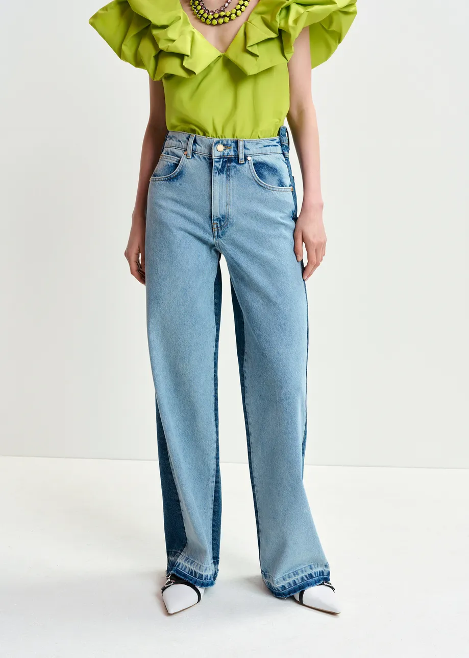 Light and dark blue contrasting panel jeans with uneven waistline and raw-cut hemline