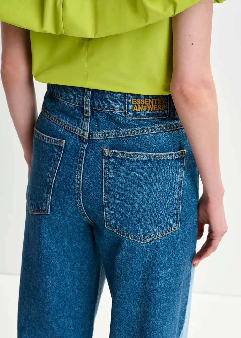 Light and dark blue contrasting panel jeans with uneven waistline and raw-cut hemline