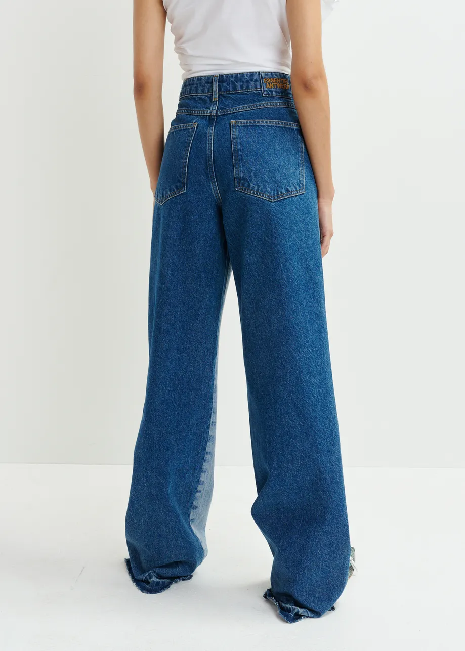 Light and dark blue contrasting panel jeans with uneven waistline and raw-cut hemline