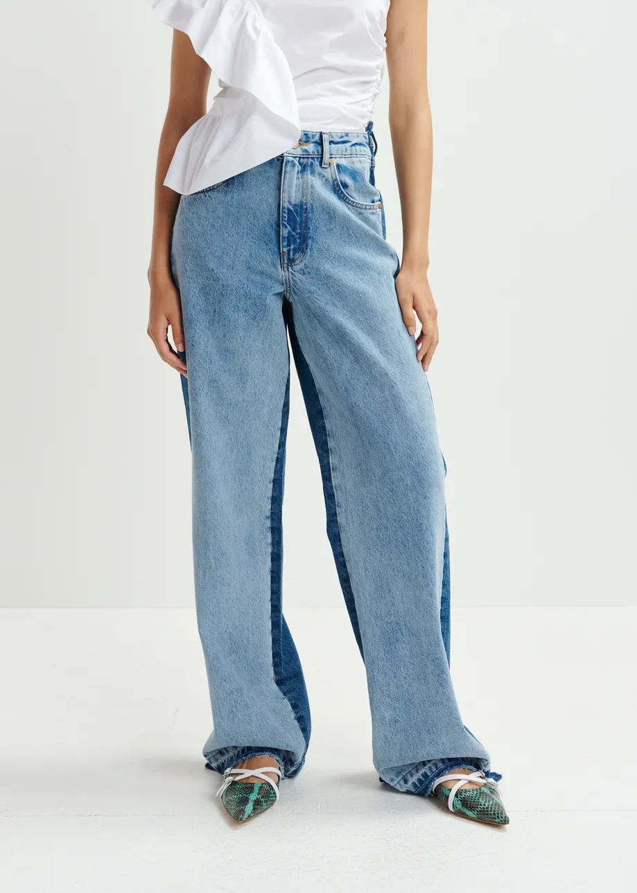 Light and dark blue contrasting panel jeans with uneven waistline and raw-cut hemline