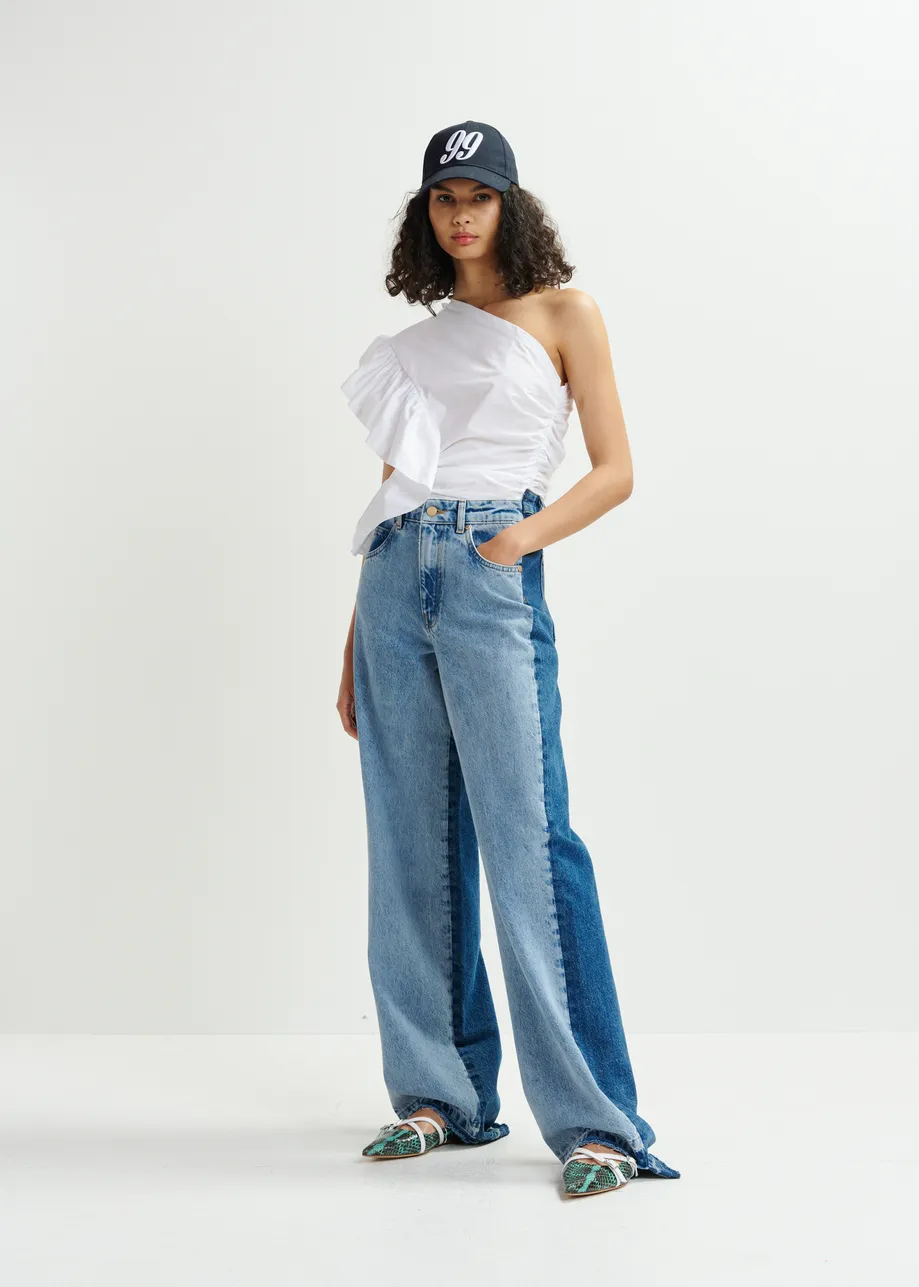 Light and dark blue contrasting panel jeans with uneven waistline and raw-cut hemline