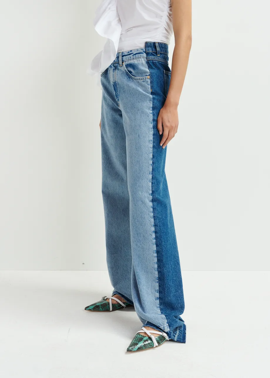 Light and dark blue contrasting panel jeans with uneven waistline and raw-cut hemline