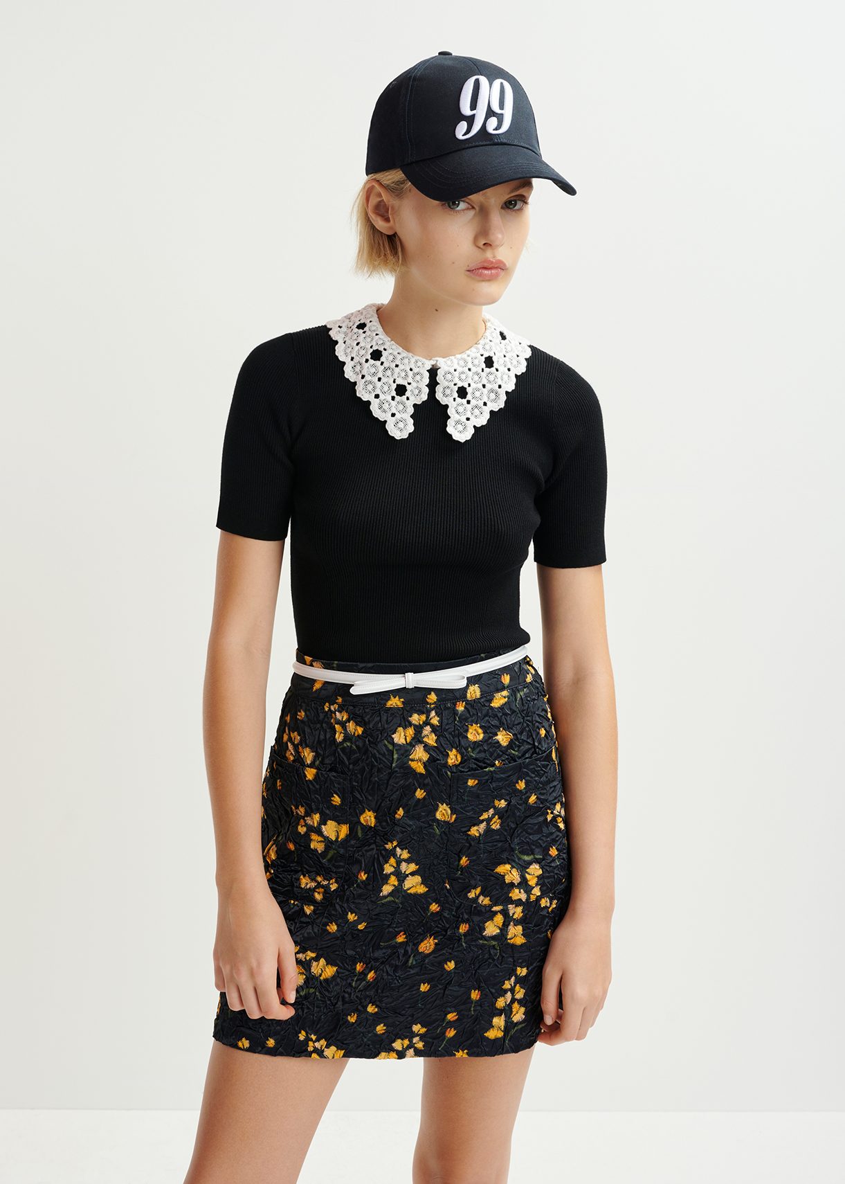 Black ribbed knitted polo top with removable lace collar
