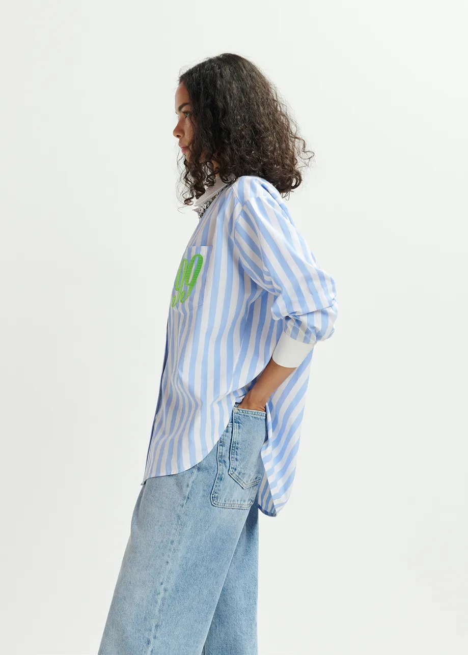 Blue, white and green striped shirt with '99' embroidery